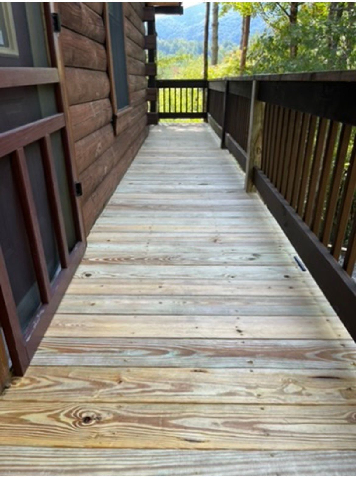 New pressure-treated walkway boards installed during a Cherry Log deck rebuild