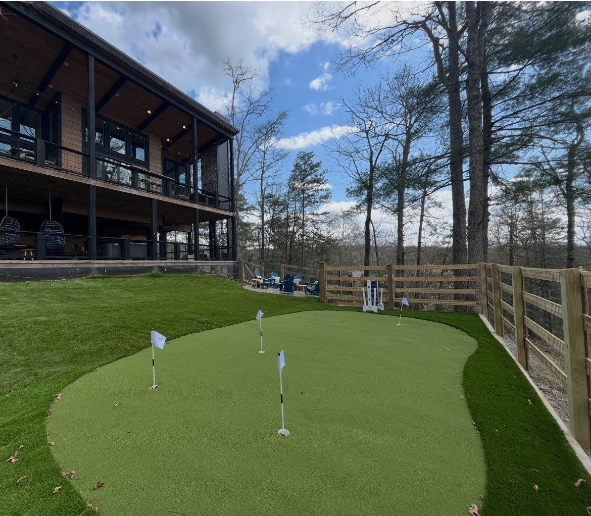 Backyard putting green installed at a North Georgia Airbnb cabin